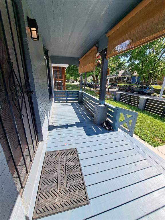 3009 Montgall Ave, Kansas City, MO 64128 - view of wooden porch