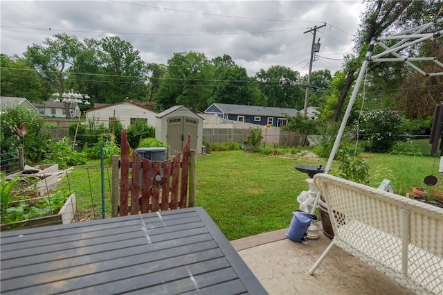 1736 Brook St, Lawrence, KS 66044 - fenced backyard with a storage shed and a garden