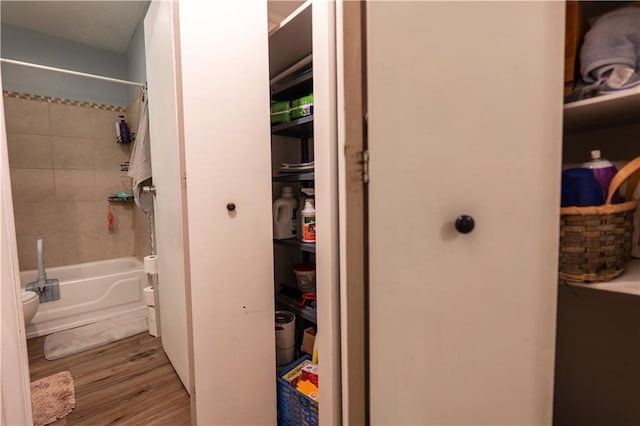 1736 Brook St, Lawrence, KS 66044 - full bath featuring wood finished floors and shower / bath combination with curtain
