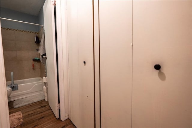 1736 Brook St, Lawrence, KS 66044 - full bath with tub / shower combination, wood finished floors, and a closet