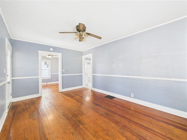 411 S Bismark, Concordia, MO 64020 - unfurnished room with a ceiling fan, crown molding, and wood-type flooring