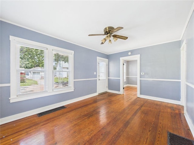 411 S Bismark, Concordia, MO 64020 - unfurnished room featuring wood-type flooring, a ceiling fan, and ornamental molding
