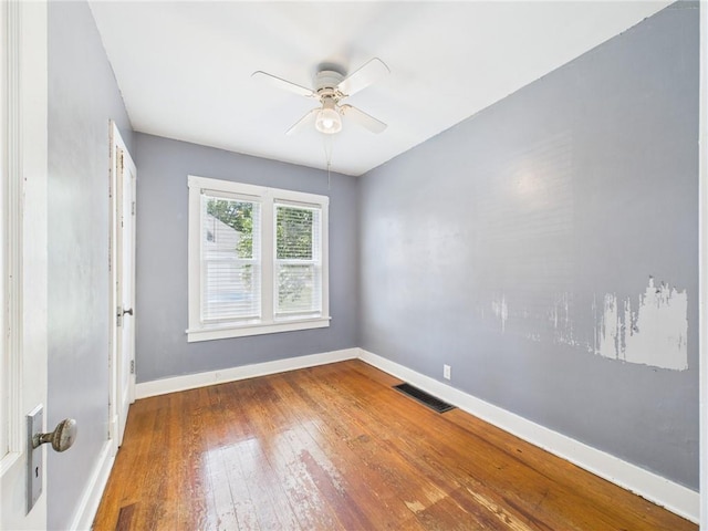 411 S Bismark, Concordia, MO 64020 - unfurnished room with hardwood / wood-style flooring and a ceiling fan