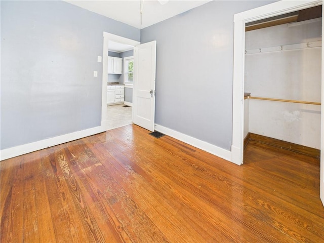 411 S Bismark, Concordia, MO 64020 - unfurnished bedroom with wood finished floors and a closet