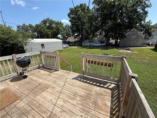 411 S Bismark, Concordia, MO 64020 - wooden deck featuring a lawn