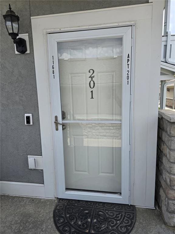 11681 S Roundtree St, Olathe, KS 66061 - property entrance featuring stucco siding