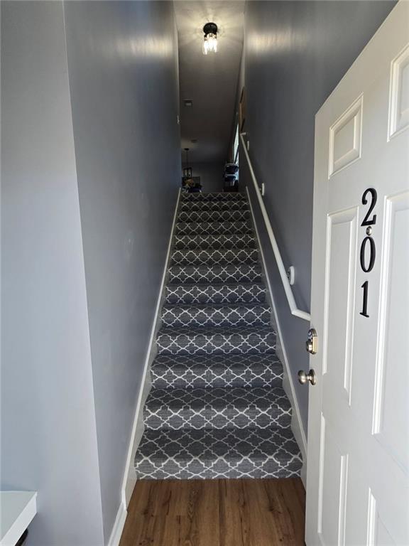 11681 S Roundtree St, Olathe, KS 66061 - stairs with wood finished floors