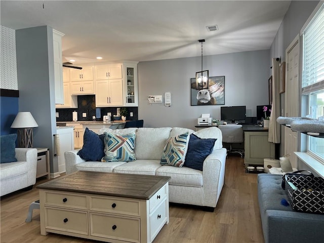 11681 S Roundtree St, Olathe, KS 66061 - living room with wood finished floors, a desk, and recessed lighting