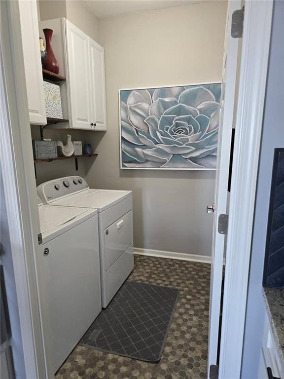 11681 S Roundtree St, Olathe, KS 66061 - laundry room with washer and dryer, dark floors, and cabinet space