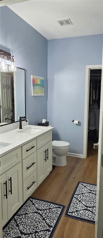 11681 S Roundtree St, Olathe, KS 66061 - bathroom featuring wood finished floors and double vanity