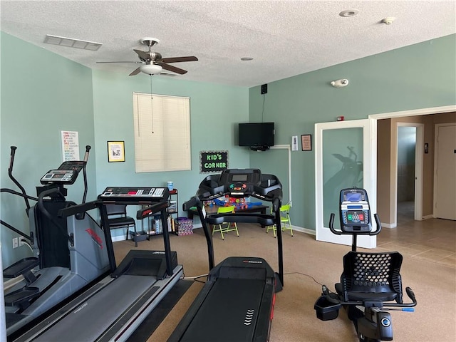 11681 S Roundtree St, Olathe, KS 66061 - exercise room with ceiling fan and a textured ceiling