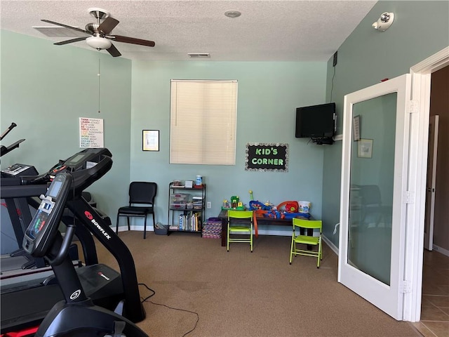 11681 S Roundtree St, Olathe, KS 66061 - workout area with a textured ceiling, ceiling fan, and carpet flooring