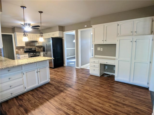 10122 Earnshaw St, Lenexa, KS 66215 - kitchen featuring stainless steel appliances, white cabinets, backsplash, and a ceiling fan