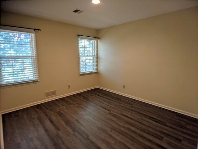 10122 Earnshaw St, Lenexa, KS 66215 - unfurnished room featuring dark wood-type flooring and recessed lighting