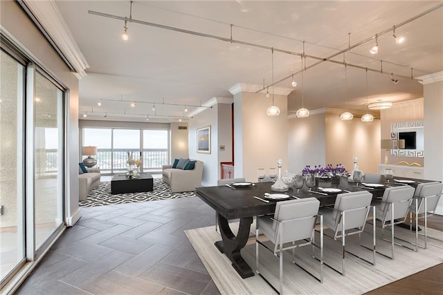 2510 Grand Blvd Unit 2502-03, Kansas City, MO 64108 - dining area with track lighting and crown molding