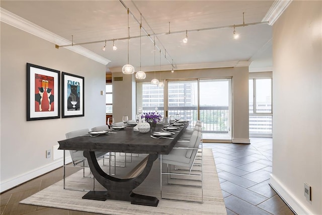 2510 Grand Blvd Unit 2502-03, Kansas City, MO 64108 - dining room with track lighting and ornamental molding