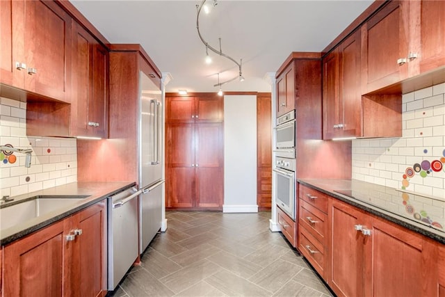 2510 Grand Blvd Unit 2502-03, Kansas City, MO 64108 - kitchen with dishwasher, white oven, dark stone countertops, and backsplash
