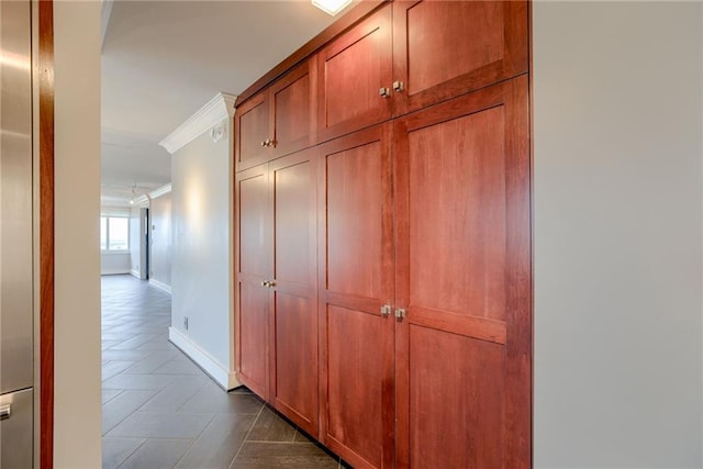 2510 Grand Blvd Unit 2502-03, Kansas City, MO 64108 - hallway with ornamental molding and dark tile patterned floors