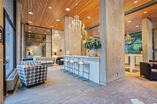 2510 Grand Blvd Unit 2502-03, Kansas City, MO 64108 - reception featuring a chandelier, wood ceiling, and recessed lighting