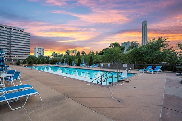 2510 Grand Blvd Unit 2502-03, Kansas City, MO 64108 - pool at dusk with a patio and a community pool