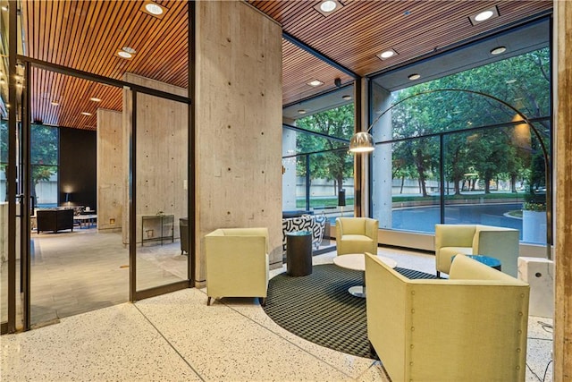 2510 Grand Blvd Unit 2502-03, Kansas City, MO 64108 - building lobby with recessed lighting, expansive windows, and a high ceiling