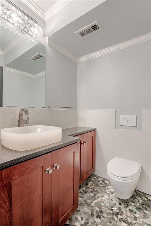 2510 Grand Blvd Unit 2502-03, Kansas City, MO 64108 - half bath with vanity, tile walls, and crown molding