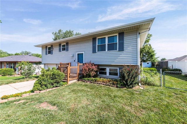 19308 E 18th St N, Independence, MO 64058 - bi-level home featuring an attached garage, concrete driveway, and a gate