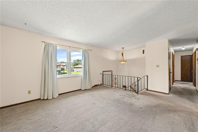 19308 E 18th St N, Independence, MO 64058 - empty room featuring a textured ceiling and carpet floors