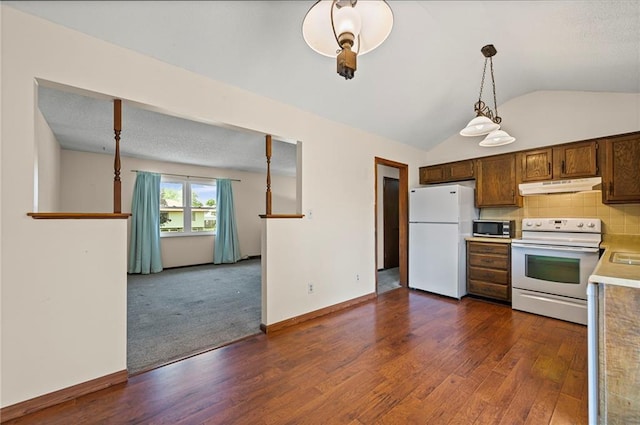 19308 E 18th St N, Independence, MO 64058 - kitchen with white appliances, under cabinet range hood, light countertops, dark wood finished floors, and vaulted ceiling