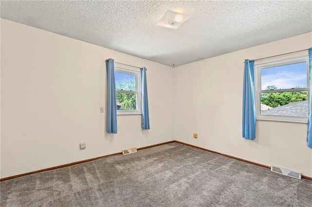 19308 E 18th St N, Independence, MO 64058 - spare room featuring carpet floors and a textured ceiling