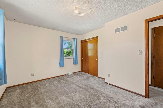 19308 E 18th St N, Independence, MO 64058 - carpeted spare room featuring a textured ceiling and baseboards