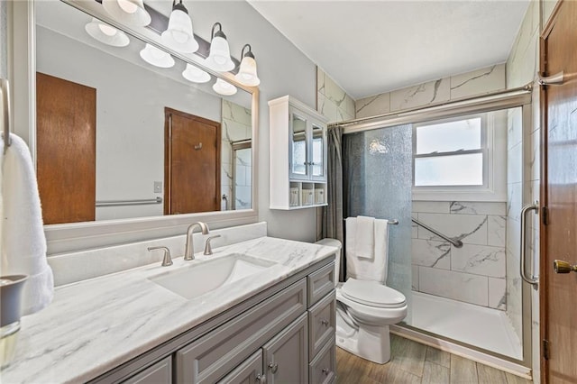 19308 E 18th St N, Independence, MO 64058 - bathroom with vanity, a stall shower, and wood finished floors