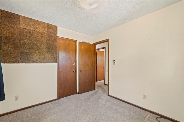 19308 E 18th St N, Independence, MO 64058 - unfurnished room featuring light carpet and a textured ceiling