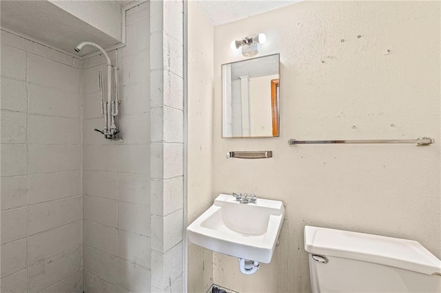 19308 E 18th St N, Independence, MO 64058 - full bathroom featuring tiled shower and a textured ceiling