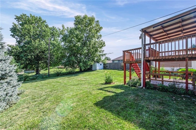 19308 E 18th St N, Independence, MO 64058 - view of yard featuring a storage unit, a wooden deck, and stairway