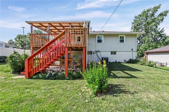 19308 E 18th St N, Independence, MO 64058 - rear view of house featuring a lawn, stairs, and a deck