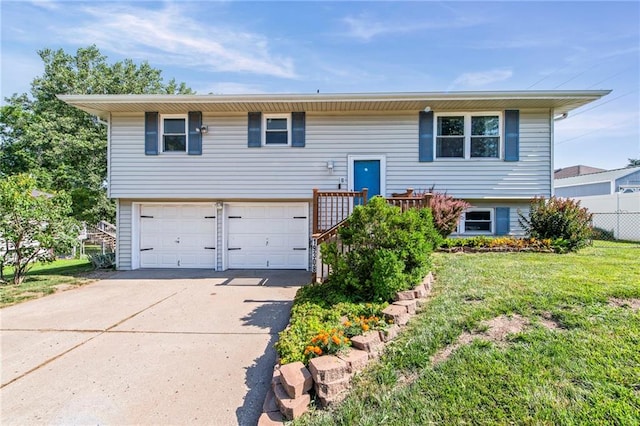 19308 E 18th St N, Independence, MO 64058 - split foyer home featuring a garage and concrete driveway