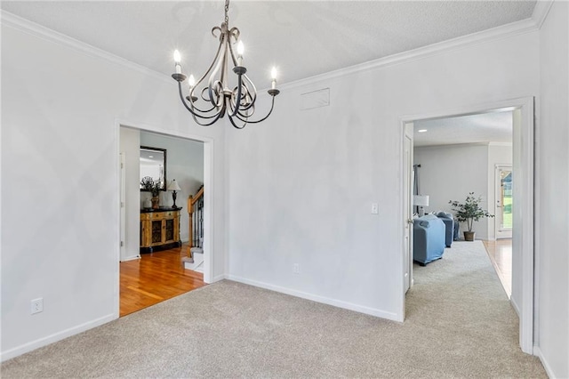 2712 SW Carlton Dr, Lees Summit, MO 64082 - unfurnished dining area with carpet, a chandelier, ornamental molding, and stairway