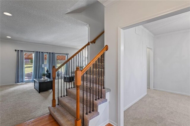 2712 SW Carlton Dr, Lees Summit, MO 64082 - staircase with carpet flooring, crown molding, a textured ceiling, and recessed lighting
