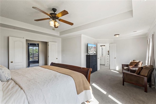 2712 SW Carlton Dr, Lees Summit, MO 64082 - carpeted bedroom featuring a raised ceiling, ornamental molding, ceiling fan, and ensuite bathroom