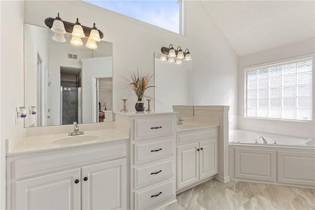 2712 SW Carlton Dr, Lees Summit, MO 64082 - bathroom with lofted ceiling, double vanity, a garden tub, and a stall shower