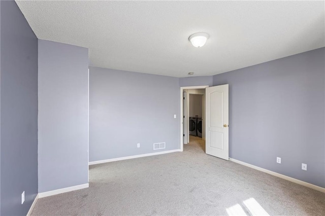 2712 SW Carlton Dr, Lees Summit, MO 64082 - empty room featuring independent washer and dryer and carpet flooring