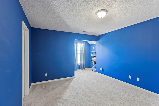 2712 SW Carlton Dr, Lees Summit, MO 64082 - spare room featuring a textured ceiling and carpet floors