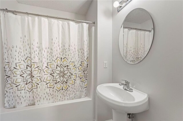 2712 SW Carlton Dr, Lees Summit, MO 64082 - bathroom with a sink and shower / bath combo