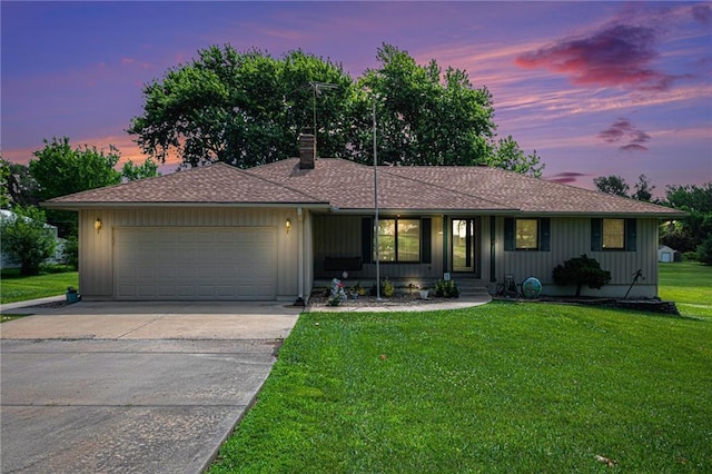 21830 155th St, Basehor, KS 66007 - ranch-style house featuring a garage, driveway, a chimney, and a lawn