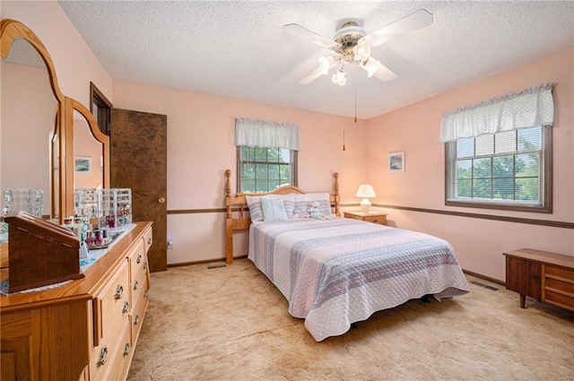 21830 155th St, Basehor, KS 66007 - bedroom with light colored carpet, a textured ceiling, and a ceiling fan