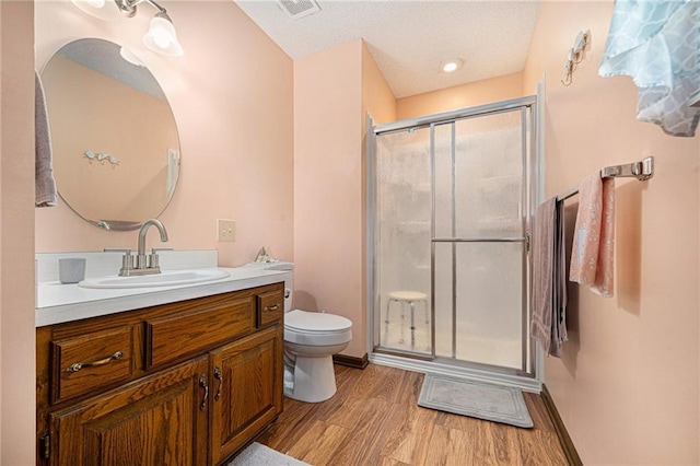 21830 155th St, Basehor, KS 66007 - bathroom with vanity, wood finished floors, and a stall shower