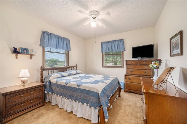 21830 155th St, Basehor, KS 66007 - bedroom featuring light colored carpet, a textured ceiling, and ceiling fan