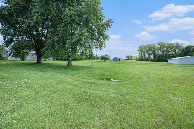 21830 155th St, Basehor, KS 66007 - view of green lawn with an outbuilding