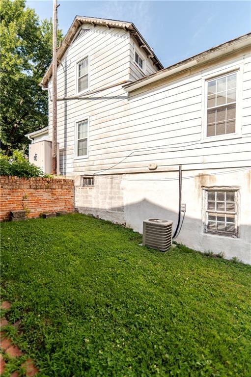 1134 Atchison St, Atchison, KS 66002 - view of home's exterior featuring a yard